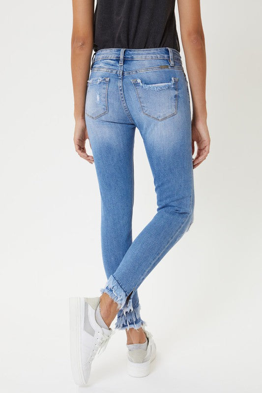 Jeans ajustados al tobillo con detalle de dobladillo de tiro medio